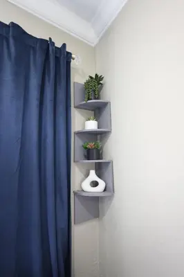 a room with a blue curtain and a shelf with plants at Walk to Stadium - 3BR King Bed Haven - Parking in Miami Gardens