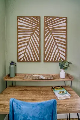 a wooden table with a blue chair and a table with a wooden window at 3-Bedroom Villa with Heated Pool and Tropical Yard in Hollywood Lakes in Hollywood