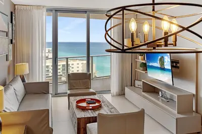 a living room with a view of the ocean at On the Beach, Ocean and City Views 17 Zen at LYFE Resort in Hollywood