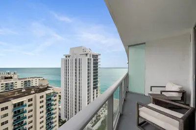 a balcony with a view of the ocean at On the Beach, Ocean and City Views 17 Zen at LYFE Resort in Hollywood