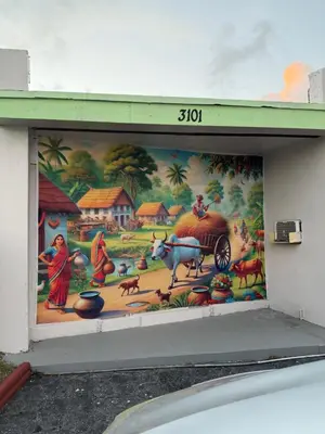 a mural on the side of a building with animals and people at Vacation Inn motel - FT Lauderdale Airport and Cruise port in Fort Lauderdale