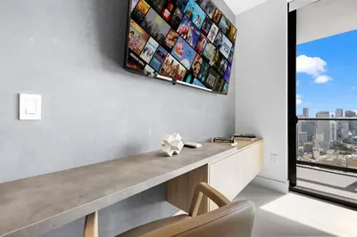 a living room with a desk and a window at On 47th Floor! Apartment With Top Amenities in Miami
