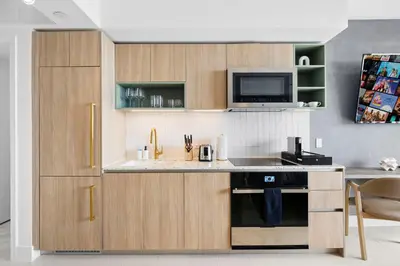 a kitchen with a sink and a microwave at On 47th Floor! Apartment With Top Amenities in Miami