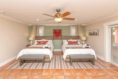 a bedroom with two beds and a ceiling fan at Casa Mexican home - Big Pool - Hot Tub - FITS 12 in Miami
