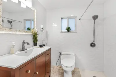a bathroom with a toilet and a sink and a shower at Casa Praga - Big pool & BBQ - Miami Fun in Tamiami
