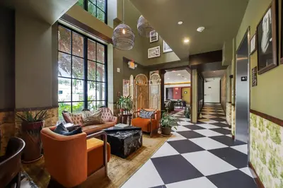 a living room with a checkered floor at Jefferson Hotel in Miami