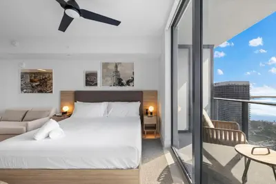 a bedroom with a bed and a living room at Luxury Studio on 47th! Floor in Downtown Miami in Miami