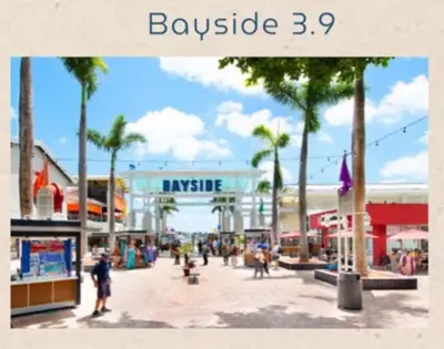a shopping center with palm trees and people walking around at Stay Where Miami Comes Alive in Miami