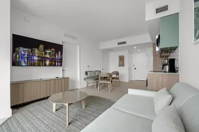 a living room with a couch and a table at Trendy Escape with Pool Gym 24th-Floor Views in Miami