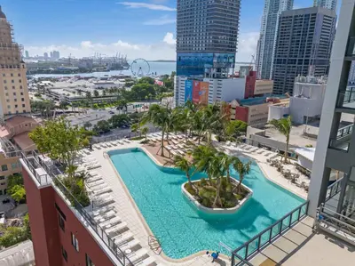 a view of the pool from the balcony of a building at Trendy Escape with Pool Gym 24th-Floor Views in Miami