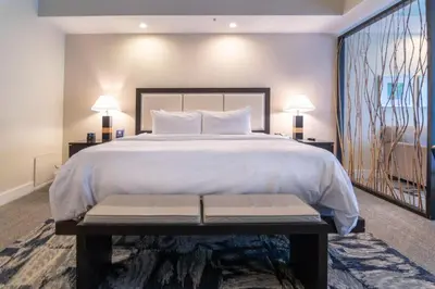 a bedroom with a large bed and a large window at Doral Pool 1407 by WaveProperties in Miami