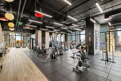 a gym with treadmills and elliptical machines at Resort-Style Living 1BR Apt in Downtown Miami in Miami