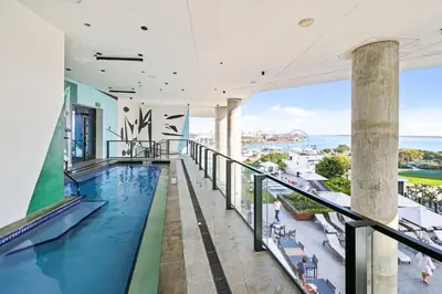 a swimming pool on the balcony of a building at Resort-Style Living 1BR Apt in Downtown Miami in Miami