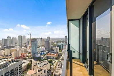 an apartment balcony with a view of a city at Resort-Style Living 1BR Apt in Downtown Miami in Miami