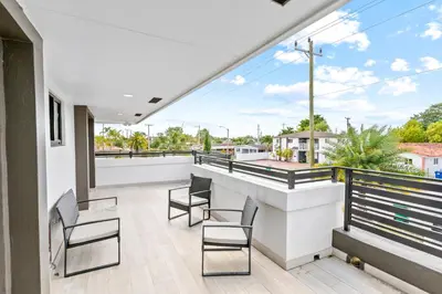 a view from the balcony of a house at April Sale! 4BR - Private Yard, Grill, Soaking Tub, Near Coral Gables & MIA Airport in Tamiami