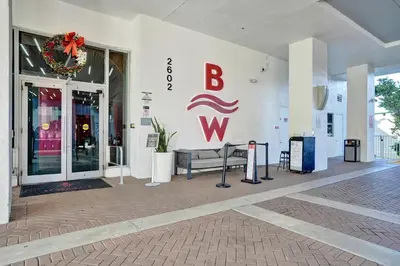 a building with a sign on the side of it at Beachwalk Resort in Hallandale Beach