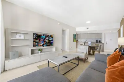 a living room with a couch and a table at Amazing Oceanfront Views From 24th floor! in Hollywood