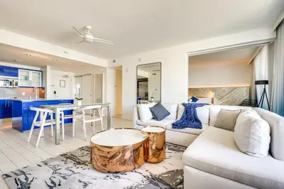 a living room with a couch and a table at Balcony with Ocean View Fort Lauderdale Oasis! in Fort Lauderdale