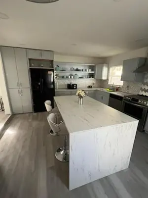 a kitchen with a white counter top in a room at ltm in North Miami