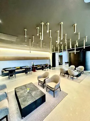 a large room with chairs and a chandelier at 43 Floor Miami 1BD Near Arena in Miami