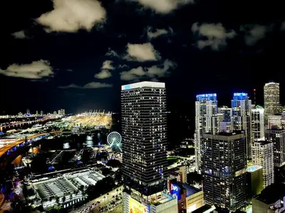 a view of a city at night with at 43 Floor Miami 1BD Near Arena in Miami