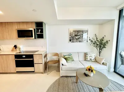 a living room with a couch and a table at 43 Floor Miami 1BD Near Arena in Miami