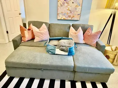 a couch with pillows and a bag on it at New Brisa Marina in Fort Lauderdale