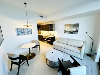a living room with a couch and a table at 48th Floor PH collection 1 BD Brand New Downtown in Miami