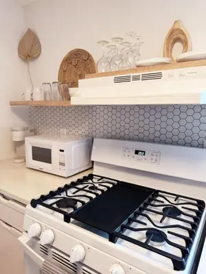 a white stove top oven in a kitchen with a microwave at Hidden Tropical Gem Calle Ocho 1 in Miami
