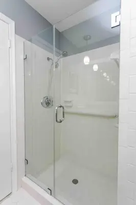 a shower with a glass door in a bathroom at MIAMI Art Villa Heated Saltwater Pool with SPA EV in Dania Beach