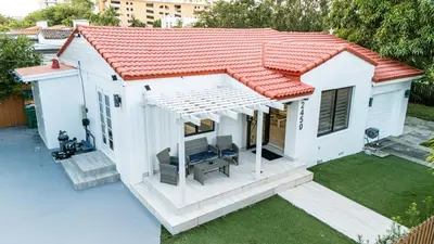 a small white house with a red roof at Luxury Retreat 3B ,2Ba POOL , Coral Gables Center in Miami