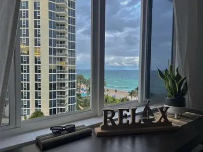 a window with a view of the beach and the ocean at Beach Escape private studio in Sunny Isles Beach