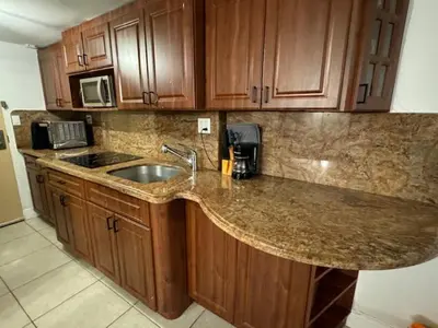 a kitchen with a sink and a counter top at Beach Escape private studio in Sunny Isles Beach