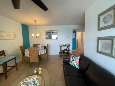 a living room with a couch and a dining room at Penthouse 2BED2BATH with ocean view & Parking - LaPlaya in Hollywood