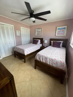 a bedroom with two beds and a ceiling fan at Penthouse 2BED2BATH with ocean view & Parking - LaPlaya in Hollywood