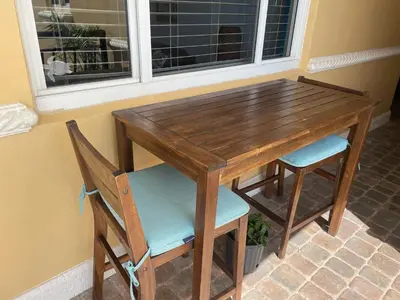 a wooden table with two chairs and a window at Penthouse 2BED2BATH with ocean view & Parking - LaPlaya in Hollywood