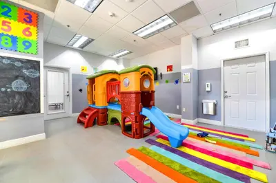 a childs play room with a slide and a playground at Exclusive 1BR Apartment on 35th floor in Miami