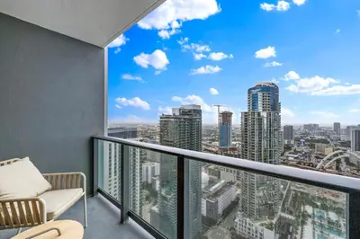 a balcony with a view of a city at On 46th Floor! Amazing Views and Free Parking in Miami