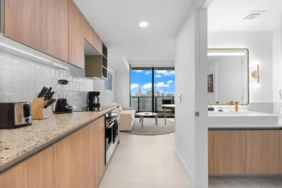 a kitchen with a sink and a counter top at Stunning Condo with Free Parking on 46th Floor! in Miami