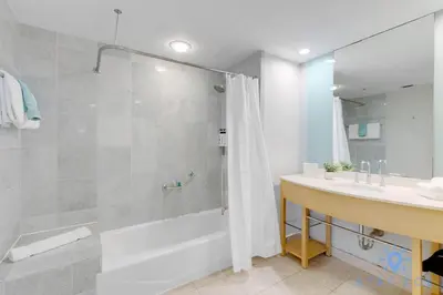 a bathroom with a shower and a sink at 1BR Apartment with Ocean View in Sunny Isles Beach