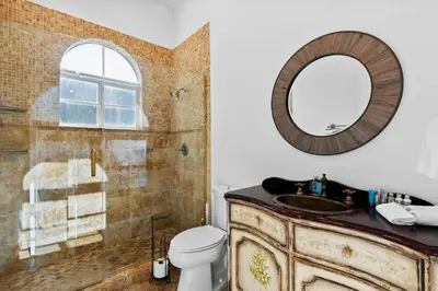 a bathroom with a sink and a mirror at Luxurious 5BR and 3BA Lakefront Villa near Beach in Hollywood