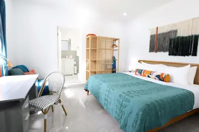 a bedroom with a bed and a chair in it at Rooftop Retreat on Ocean Drive with Beach View in Miami Beach