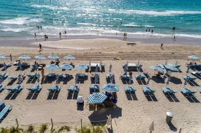 an overhead view of a beach with chairs and umbrellas at Luxury 2BR Pools & Free Parking in Hollywood