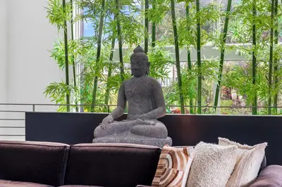 a large statue sitting on top of a couch at Villa Nova in Miami