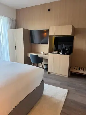 a hotel room with a bed and a desk at The March Hotel in Miami Beach