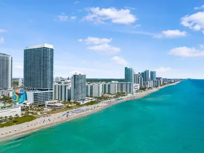 an aerial view of a beach in front of a city at Beautiful Views From a Comfortable Condo with Beach Access! in Hollywood