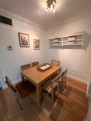 a dining room with a wooden table and chairs at Key Biscayne Beach Vacation in Miami