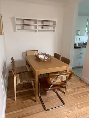 a wooden table and chairs in a kitchen at Key Biscayne Beach Vacation in Miami
