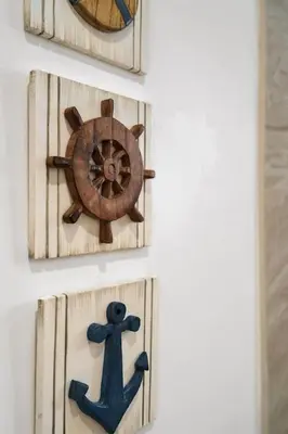 three wooden wall clocks with a steering wheel at Magical 2 BR Apartment 5 mins to Brickell Best Area in Miami in Miami