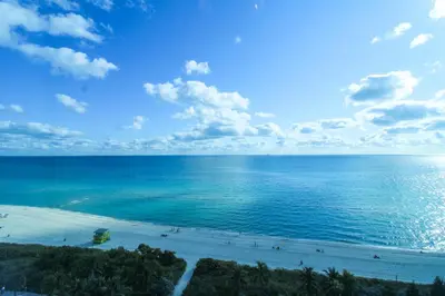 an ocean view of a beach with people on it at Castle 1133 Ocean view studio, Pool and Beach Access, FREE Parking, Tennis and more! in Miami Beach